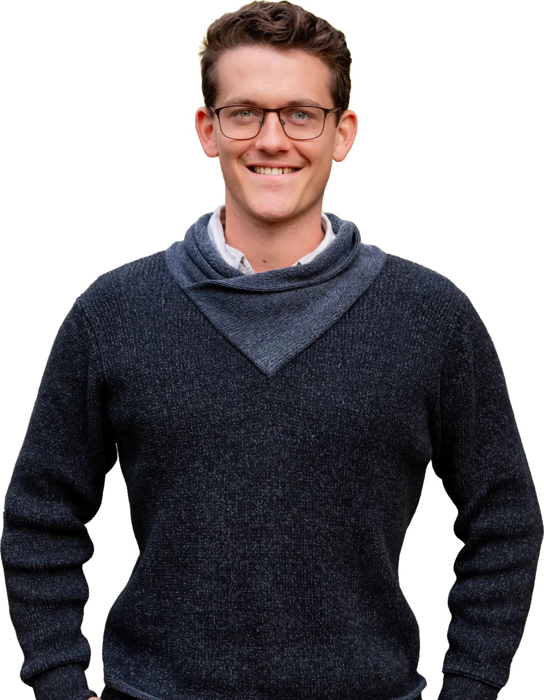 Walker Schuchardt, smiling, in a navy sweater